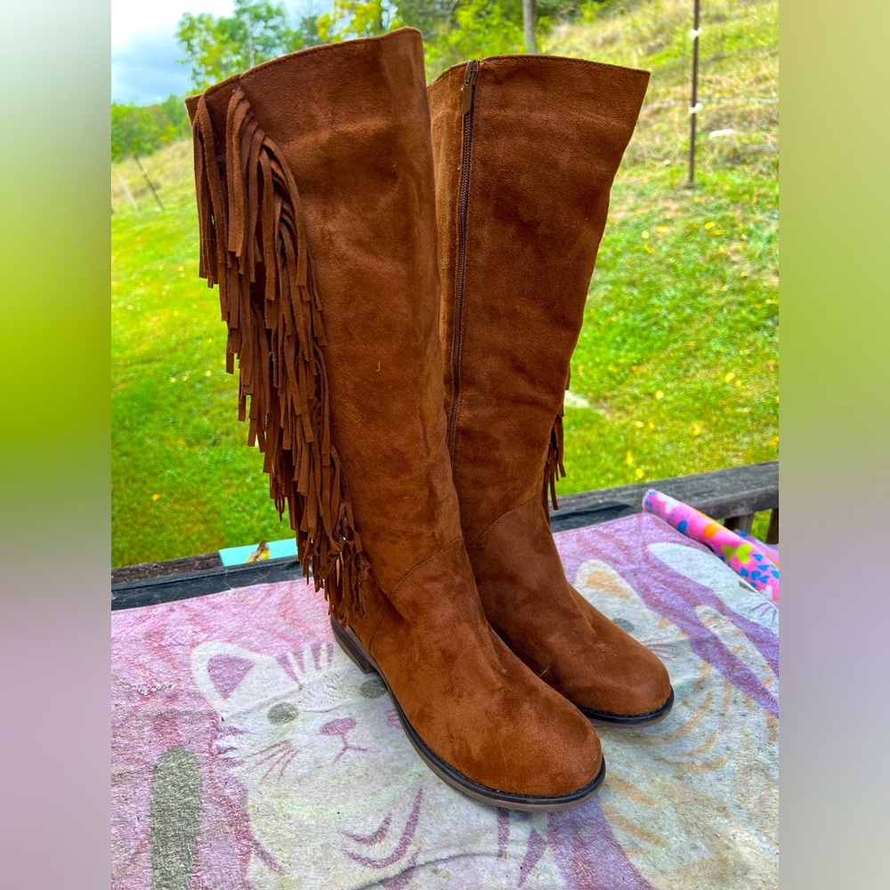 Knee high suede fringed boots. Worn only a couple of times